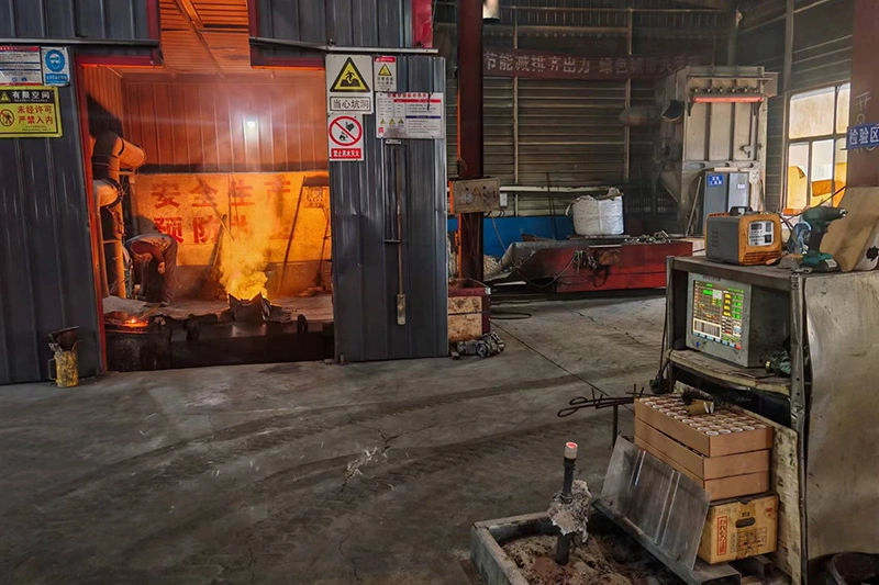 A factory interior featuring a large machine used for producing metal castings