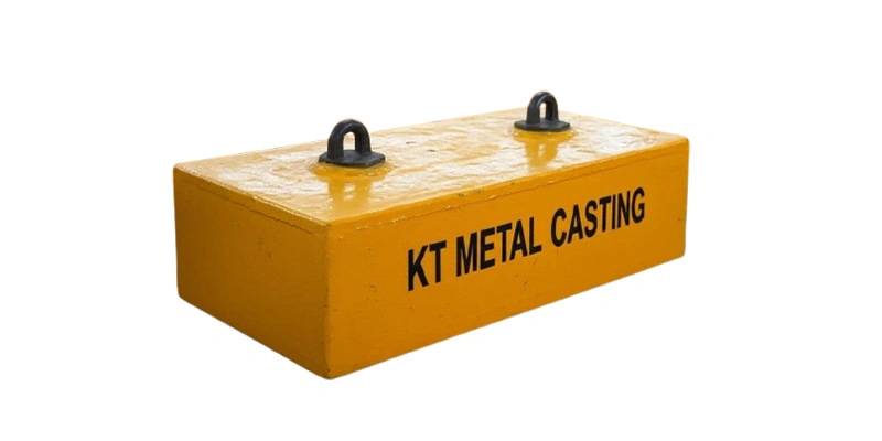 A large collection of yellow metal casting boxes used as counterweights, arranged neatly in a manufacturing setting