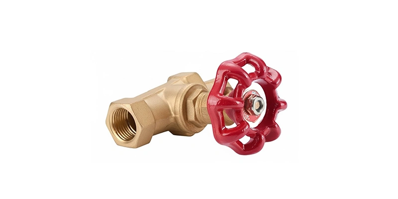 A red valve positioned against a plain white background, highlighting its design and color contrast