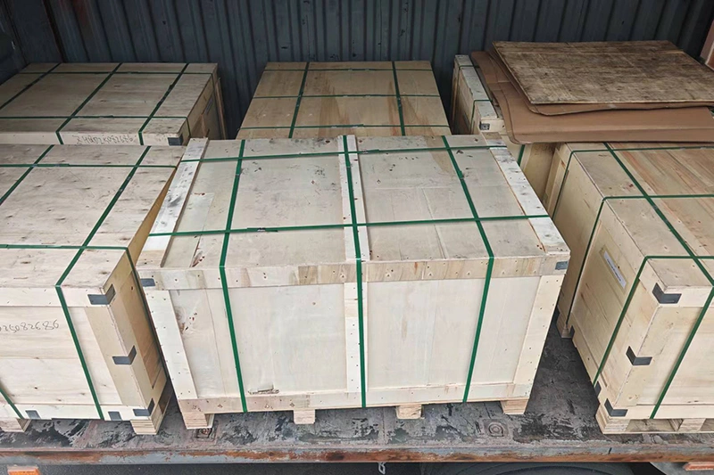 Several wooden boxes stacked vertically, labeled as sand castings