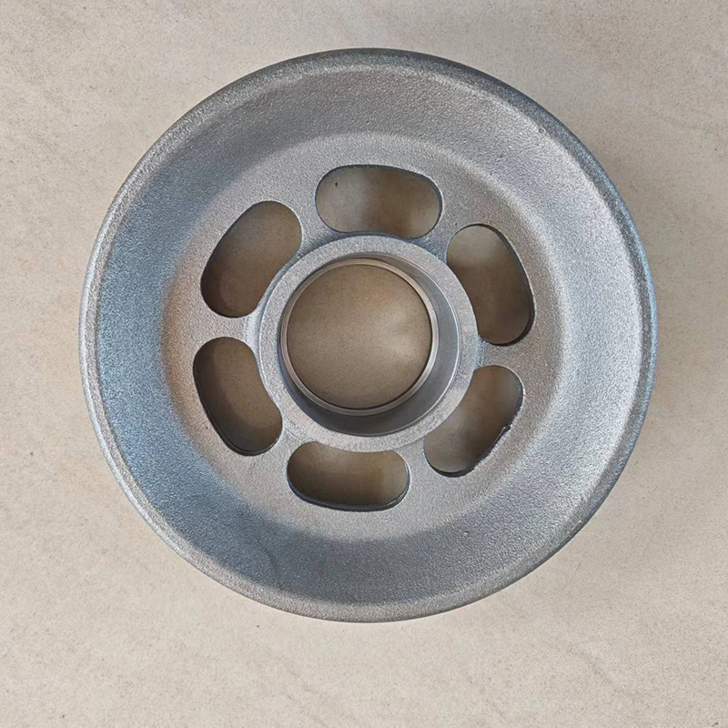 Overhead view of a circular iron wheel, showcasing its metallic texture and structural design